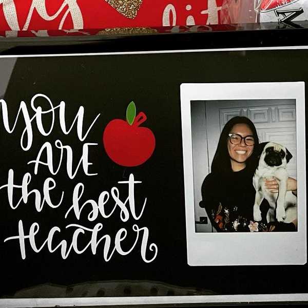 Black picture frame with text reading 'you are the best teacher'